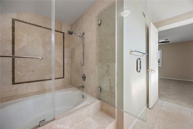 bathroom featuring combined bath / shower with glass door and tile patterned floors