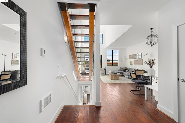 interior space with a chandelier and hardwood / wood-style flooring