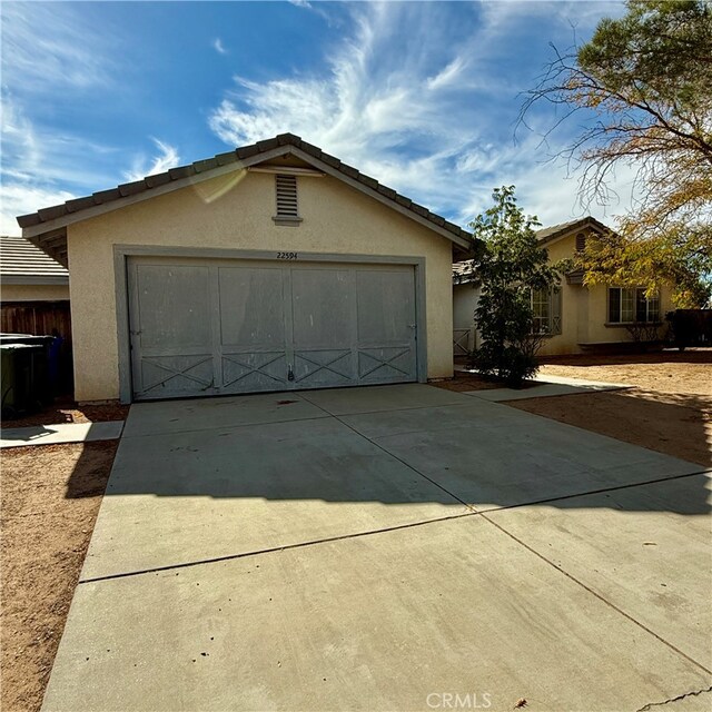 ranch-style house featuring a garage