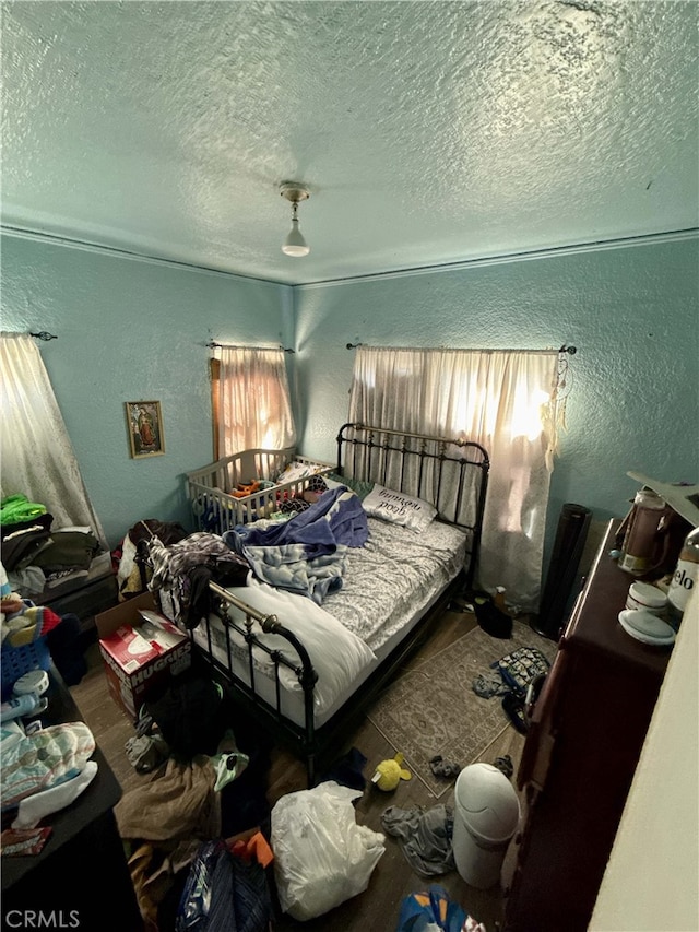 bedroom featuring a textured ceiling