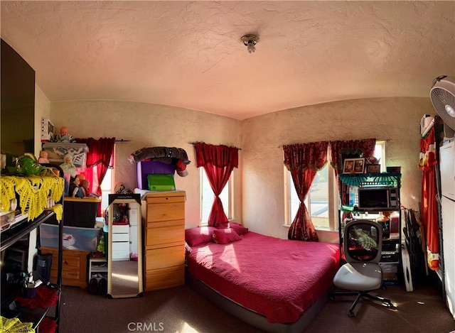 bedroom featuring vaulted ceiling