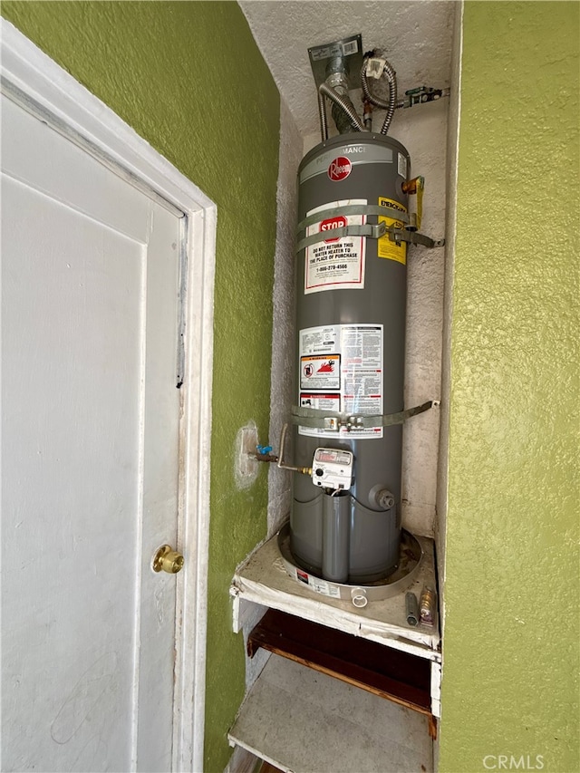 utility room with water heater