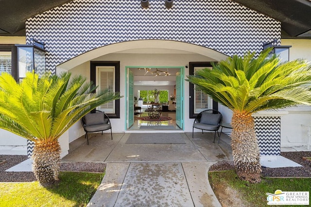 entrance to property featuring a patio