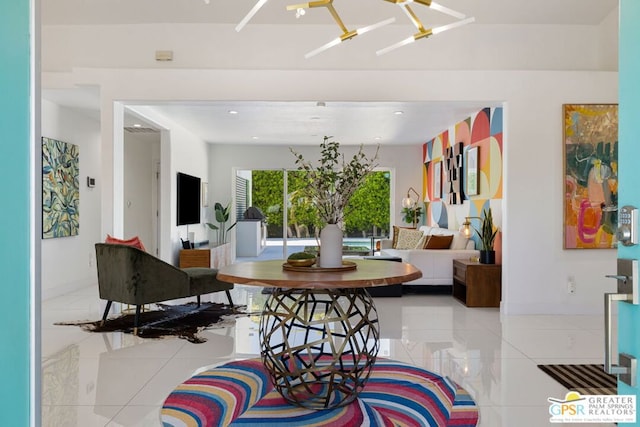 dining space with an inviting chandelier