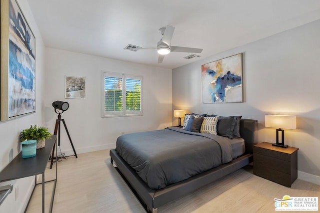 bedroom with ceiling fan and light wood-type flooring