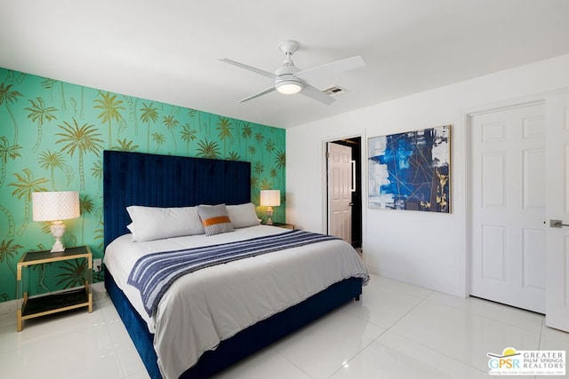 bedroom with tile patterned flooring and ceiling fan