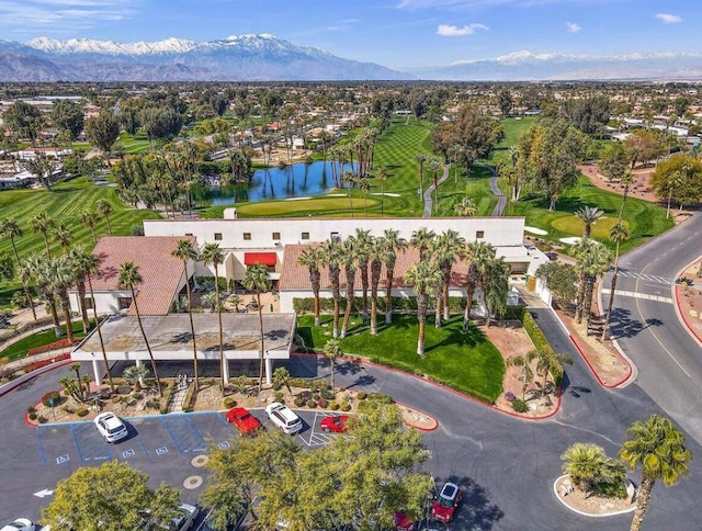 drone / aerial view featuring a water and mountain view