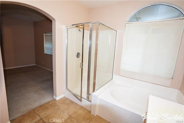 bathroom with plus walk in shower and tile patterned floors