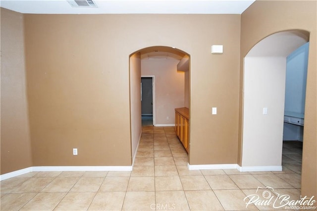 spare room with light tile patterned floors