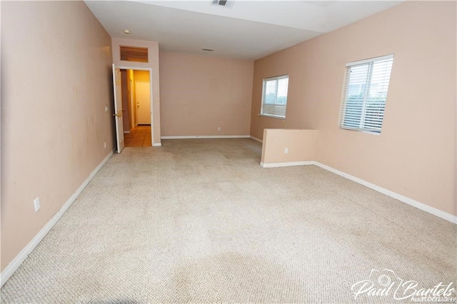 spare room with light colored carpet