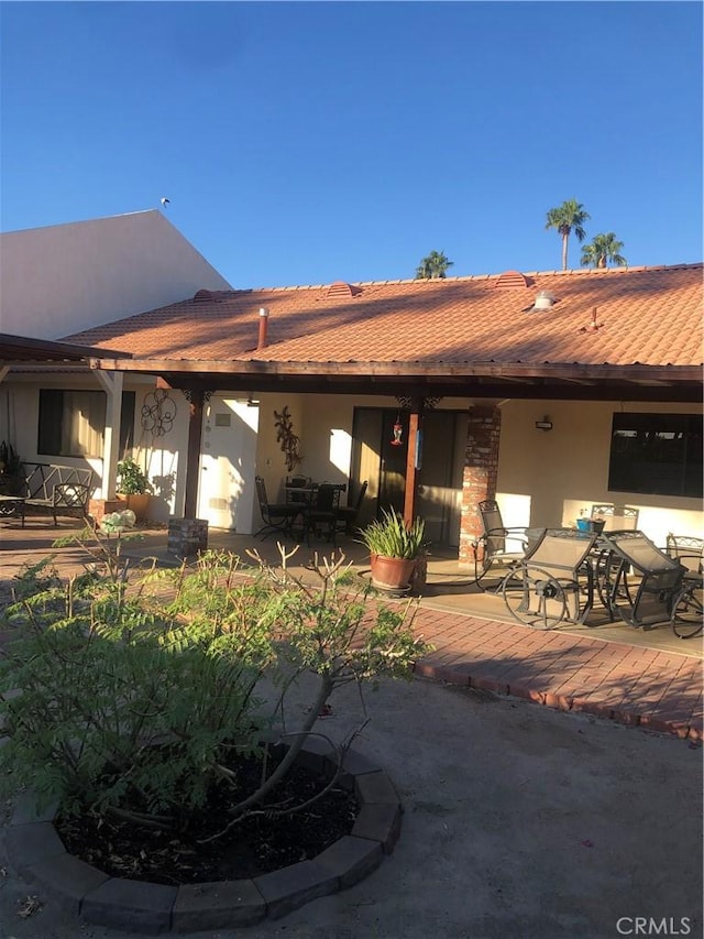 rear view of property with a patio