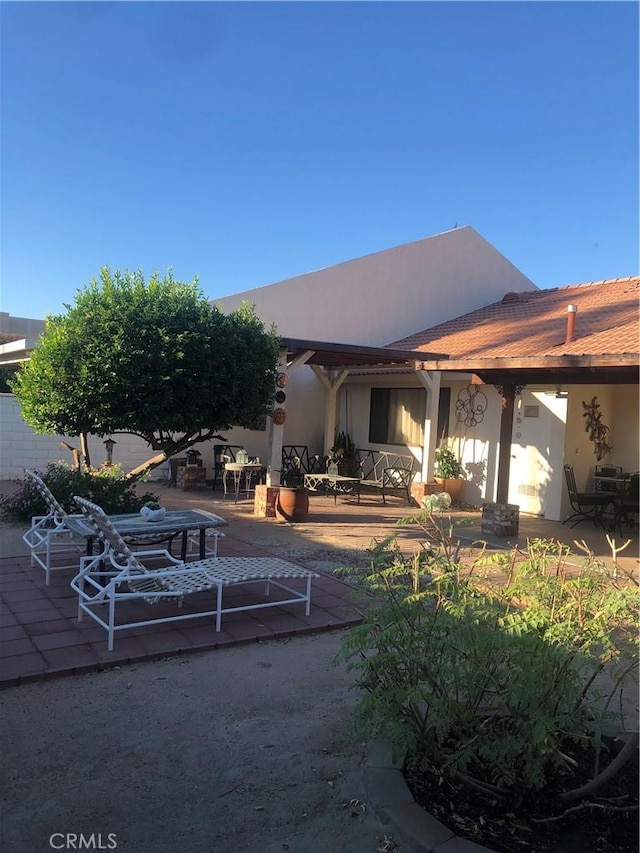 rear view of house featuring a patio