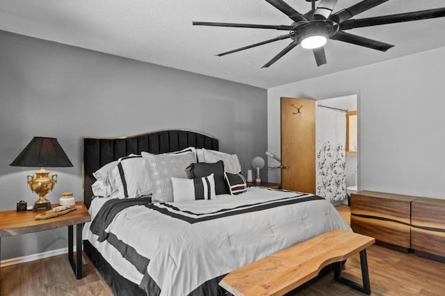 bedroom with ceiling fan and hardwood / wood-style flooring