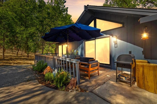 exterior space featuring a grill and a wooden deck