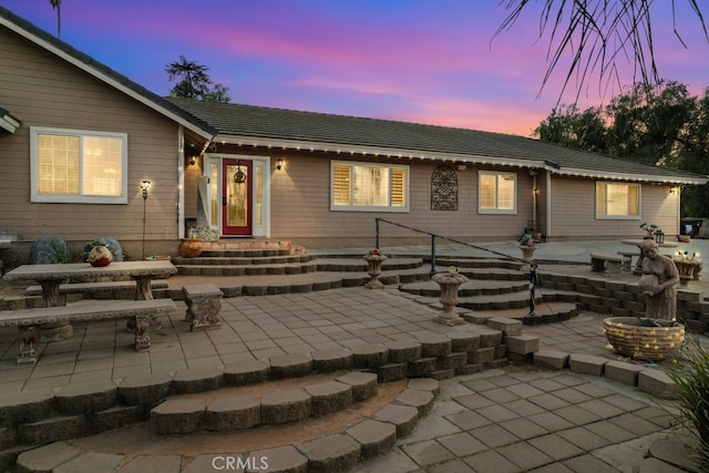 view of front of property featuring a patio