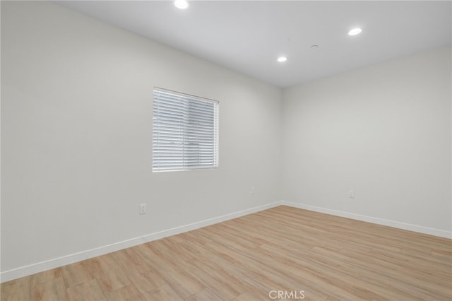 spare room featuring light wood-type flooring