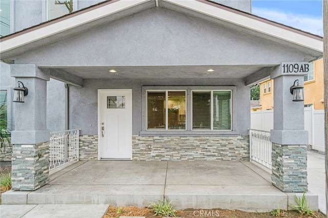 property entrance featuring a patio