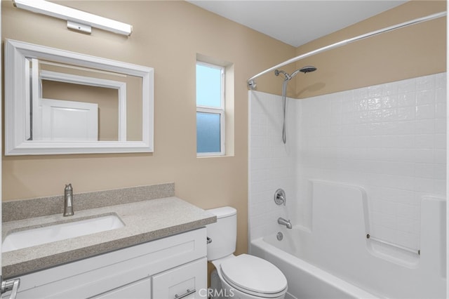 full bathroom featuring toilet, bathing tub / shower combination, and vanity