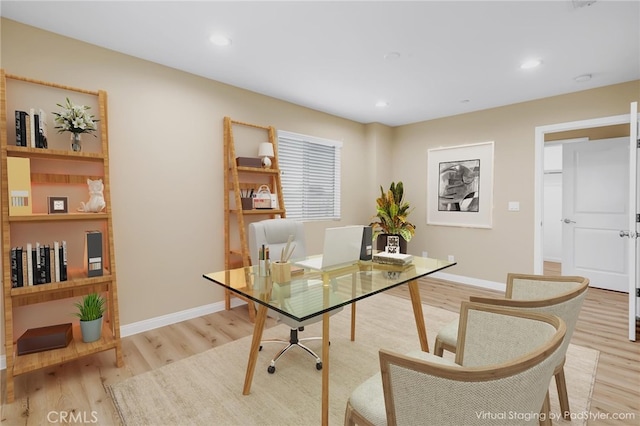 office featuring baseboards, light wood-style flooring, and recessed lighting