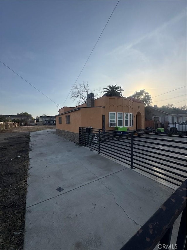 view of property exterior at dusk