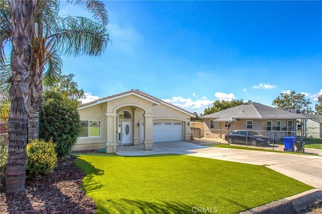 view of front of home featuring a front yard and a garage