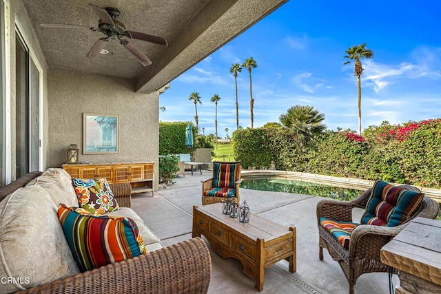 view of patio / terrace with an outdoor living space and ceiling fan