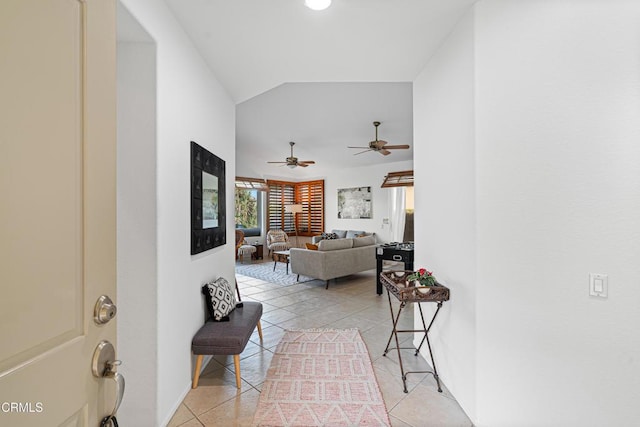 tiled living room with vaulted ceiling and ceiling fan