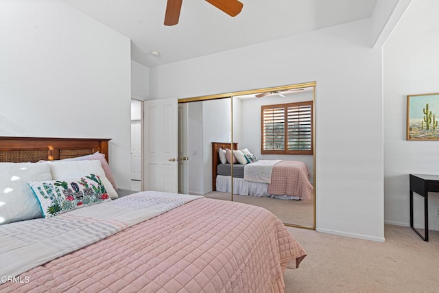 carpeted bedroom with ceiling fan and a closet