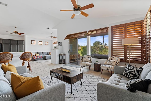 living room with light tile patterned floors, vaulted ceiling, and ceiling fan