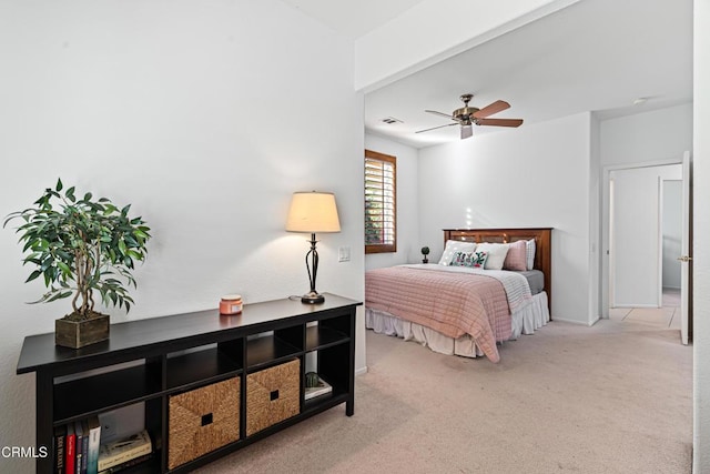 bedroom featuring ceiling fan and light carpet