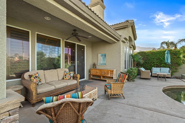 view of patio / terrace with ceiling fan and an outdoor hangout area