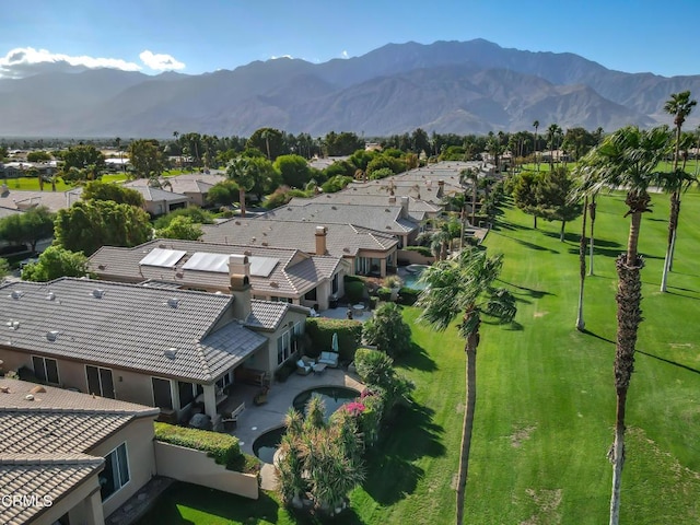 birds eye view of property with a mountain view