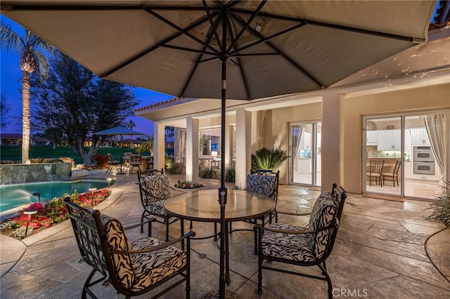 view of patio / terrace with pool water feature