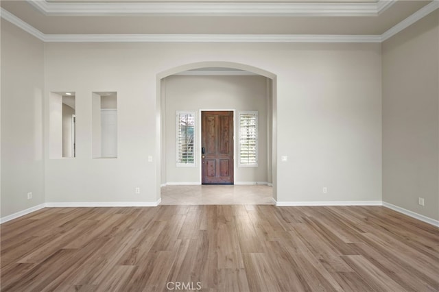 entrance foyer featuring light hardwood / wood-style floors and ornamental molding