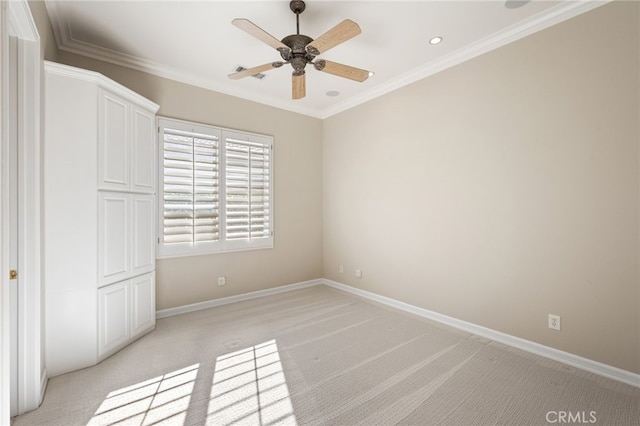 unfurnished bedroom with ceiling fan, ornamental molding, light carpet, and a closet