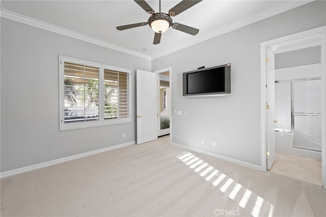 unfurnished bedroom with light carpet, ensuite bathroom, ceiling fan, and crown molding