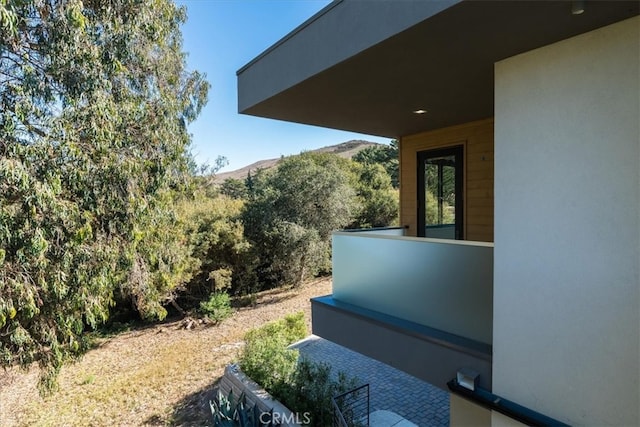 view of side of property with a mountain view