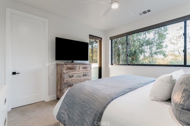 carpeted bedroom with ceiling fan