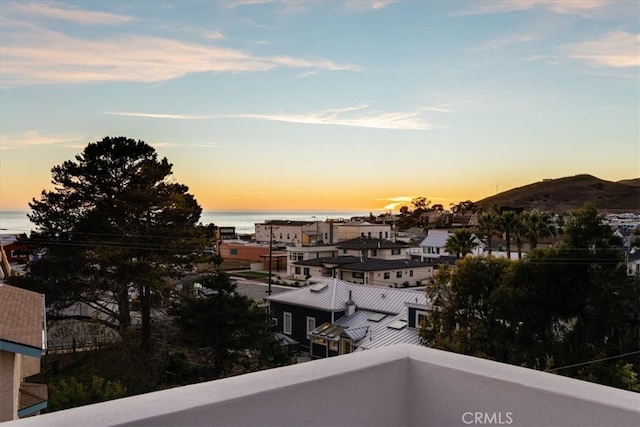 balcony at dusk with a water view