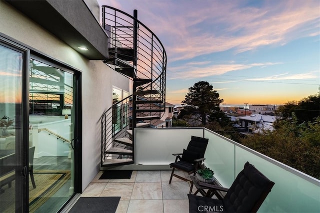 view of balcony at dusk