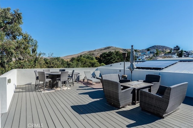 wooden terrace featuring a mountain view