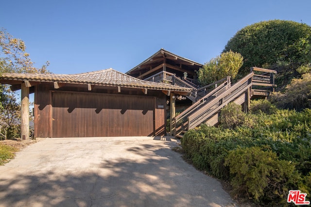 view of side of home with a garage