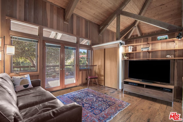 living room with french doors, beamed ceiling, high vaulted ceiling, hardwood / wood-style floors, and wood ceiling