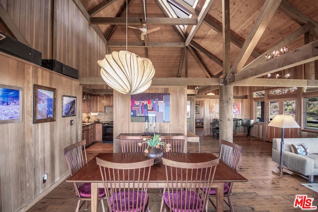 dining space featuring beam ceiling, wooden walls, high vaulted ceiling, and hardwood / wood-style flooring