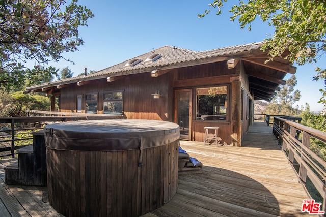 deck featuring a hot tub