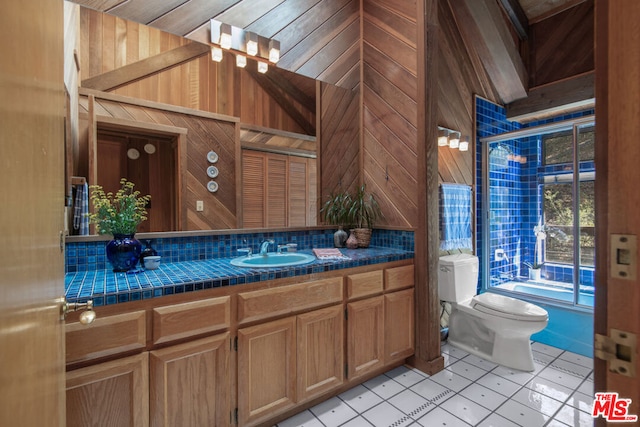 bathroom with vanity, wooden walls, tile patterned flooring, toilet, and wood ceiling