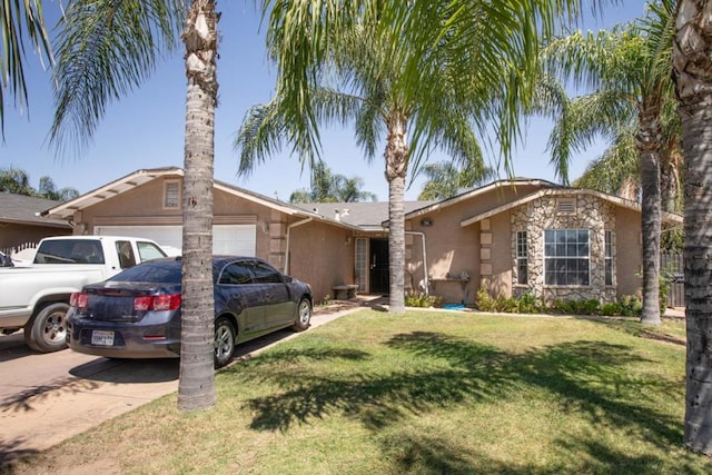 single story home with a front yard and a garage