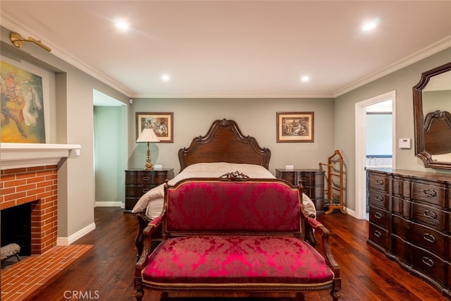 bedroom featuring dark hardwood / wood-style flooring, a brick fireplace, and ornamental molding