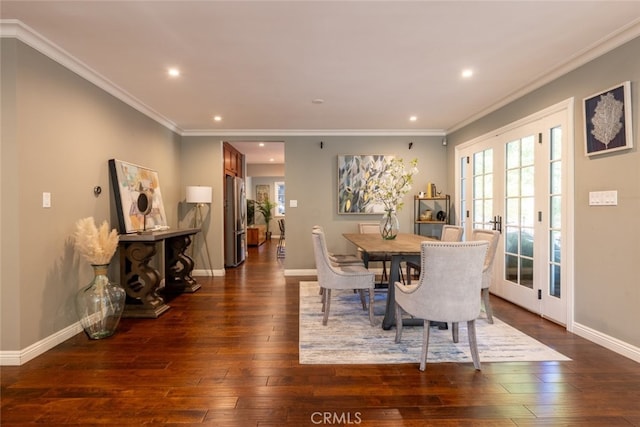 dining room featuring french doors, dark hardwood / wood-style floors, and ornamental molding