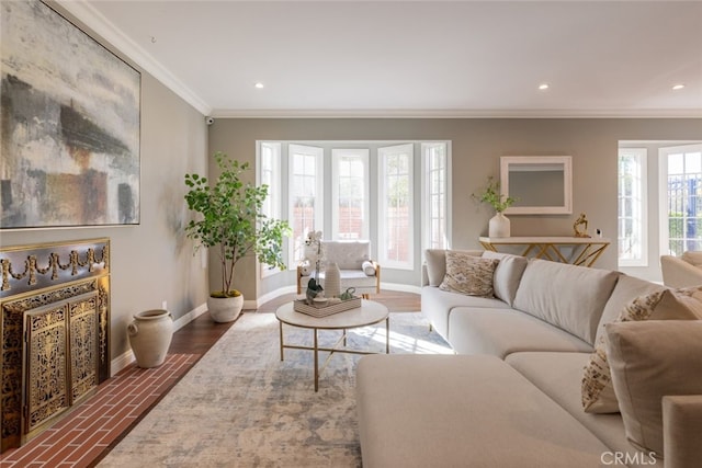 living room with hardwood / wood-style floors, plenty of natural light, and crown molding